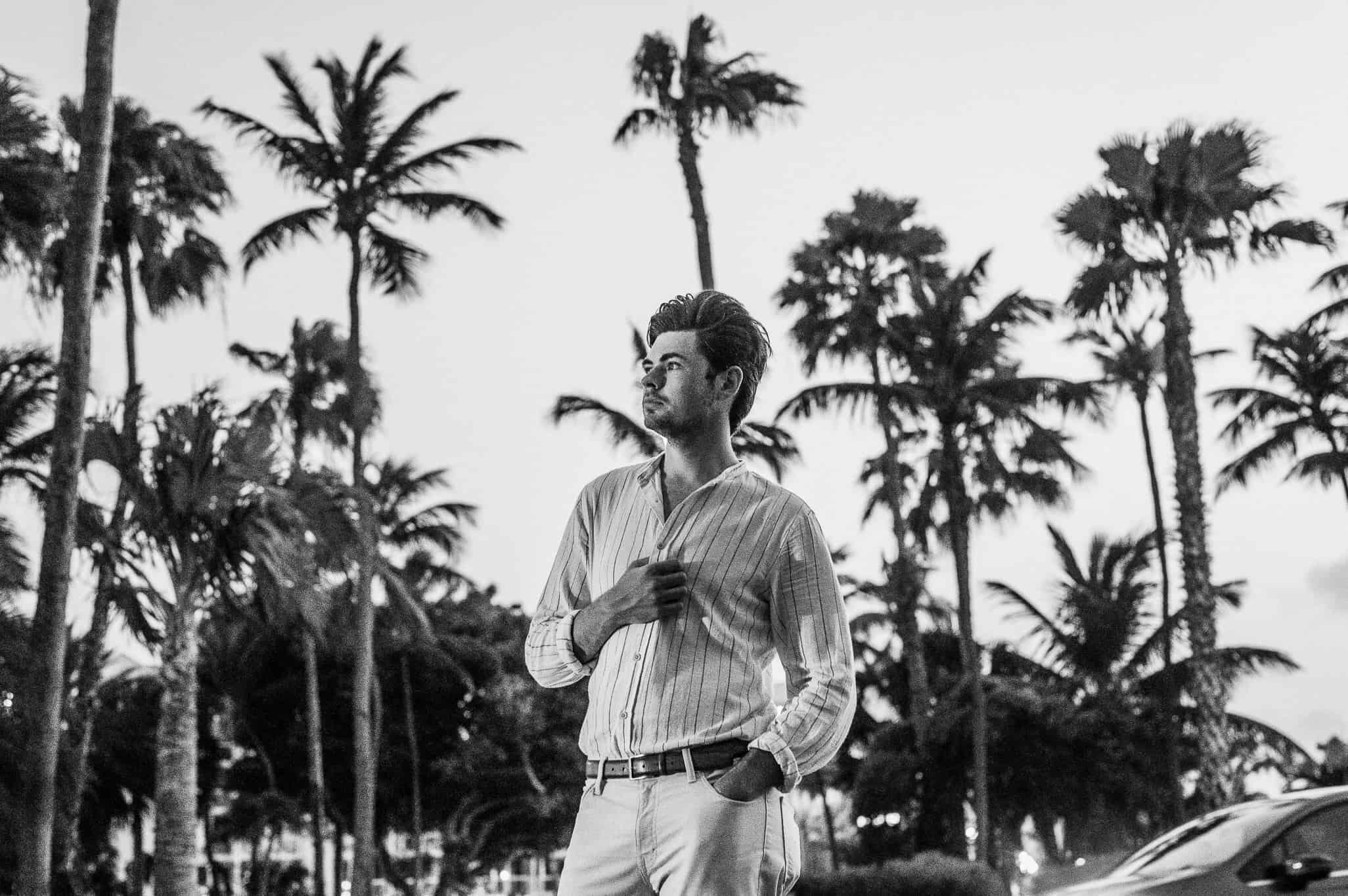 Man standing car exploring Aruba