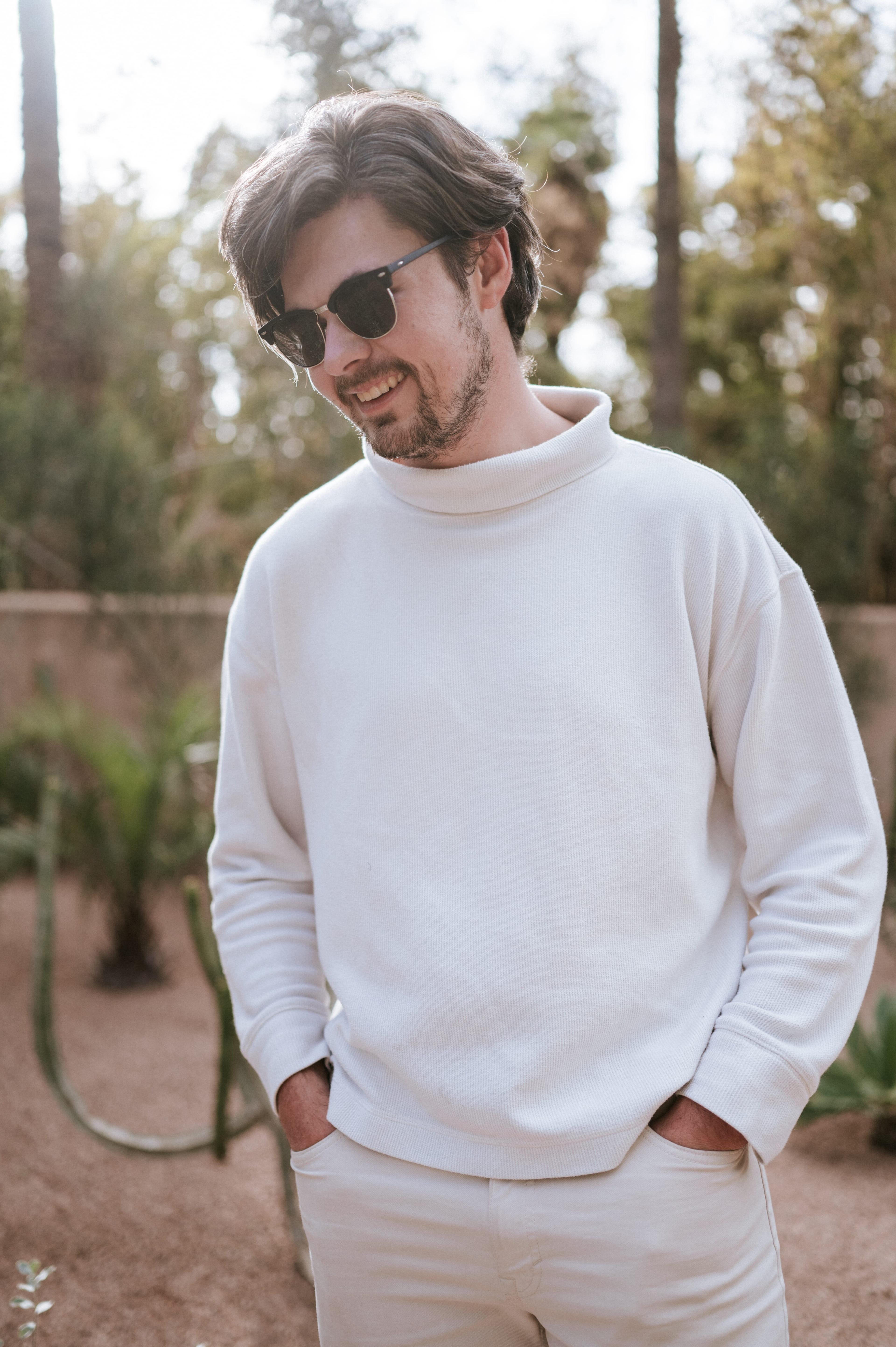 Man white sweater sunglasses