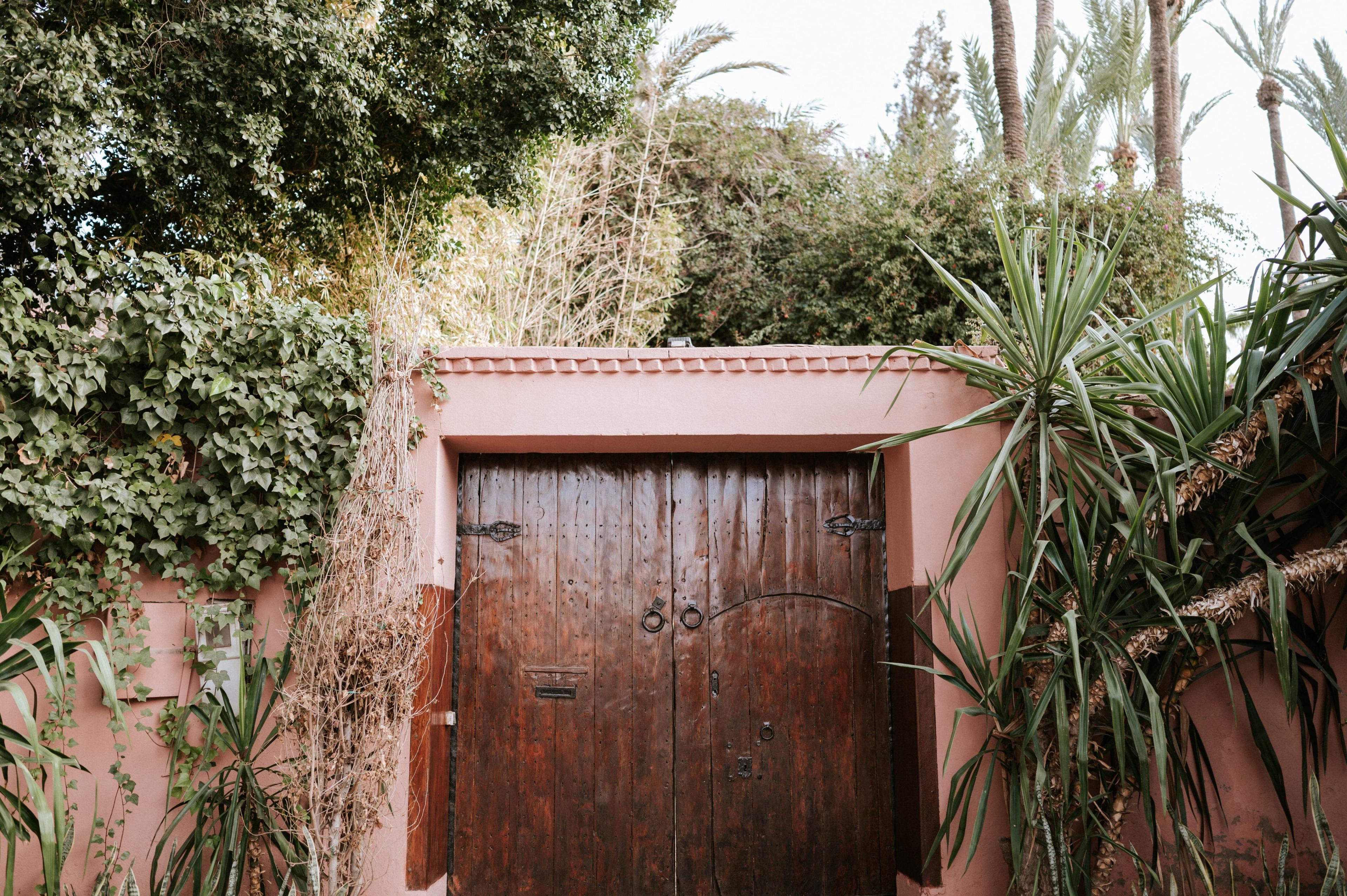 Pink wall wooden door marrakech