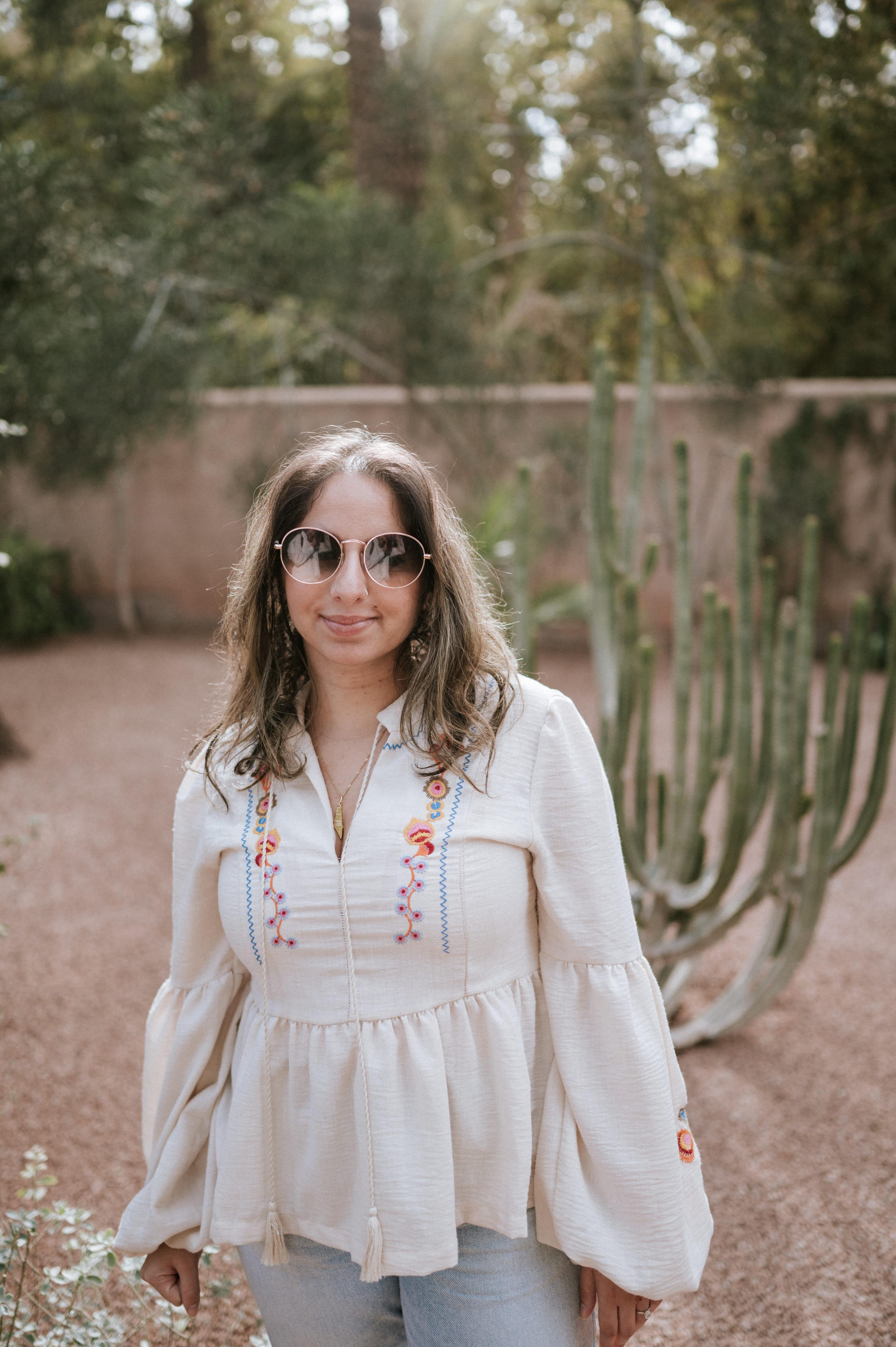 Woman standing cactus view