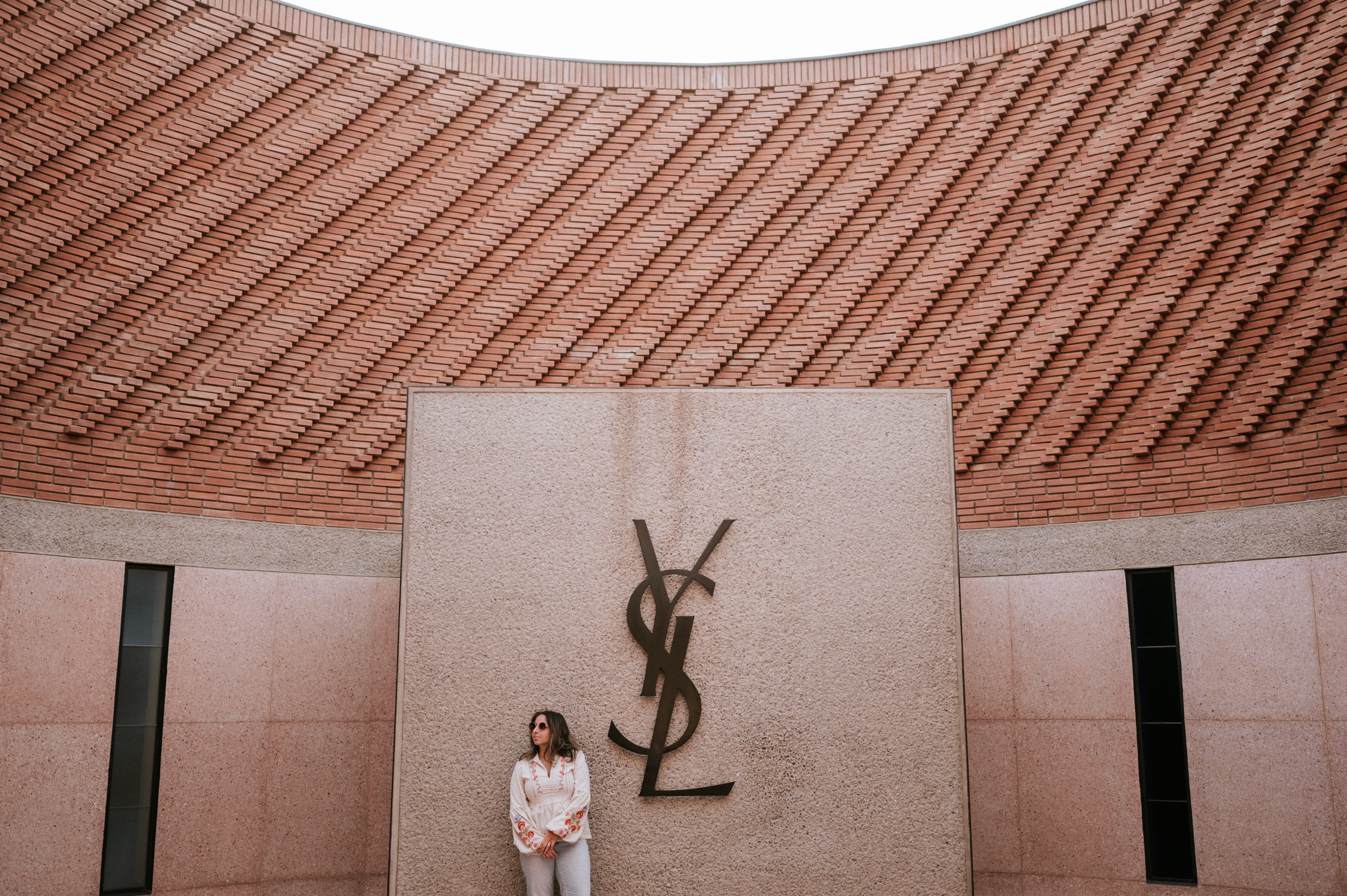 Woman standing front building