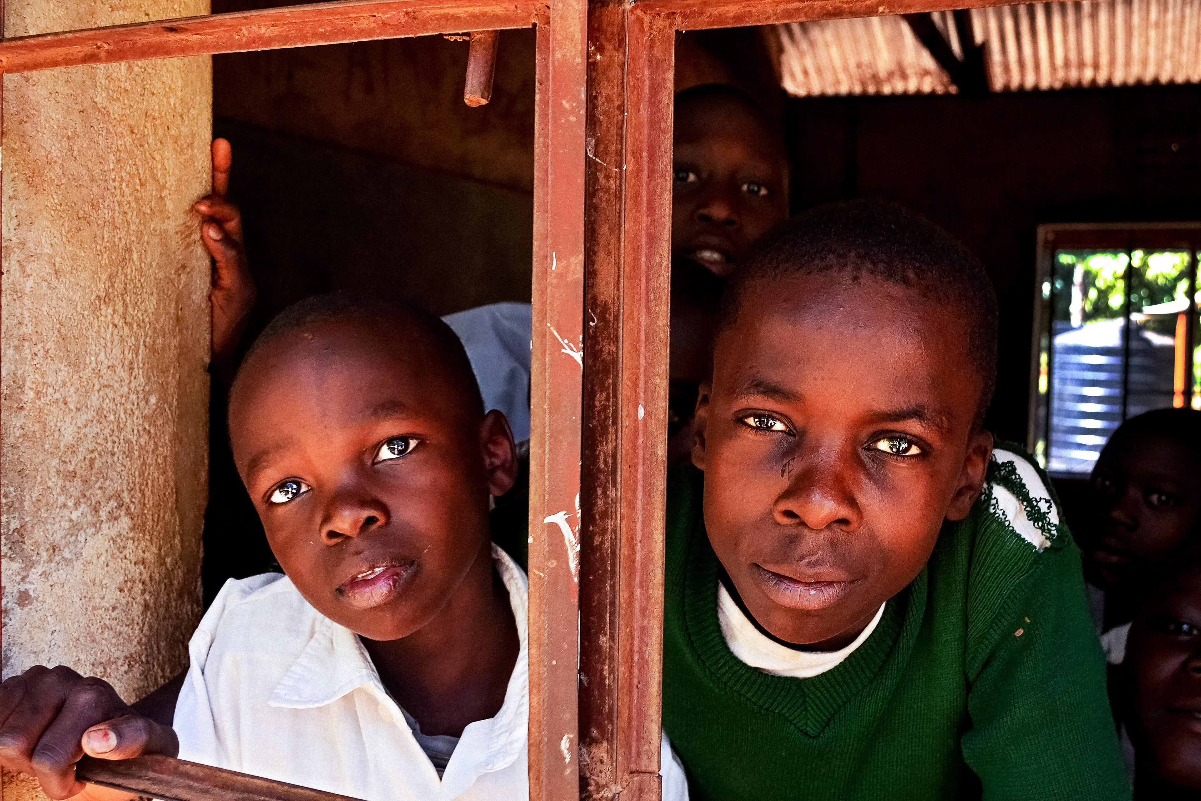 Children watching through window