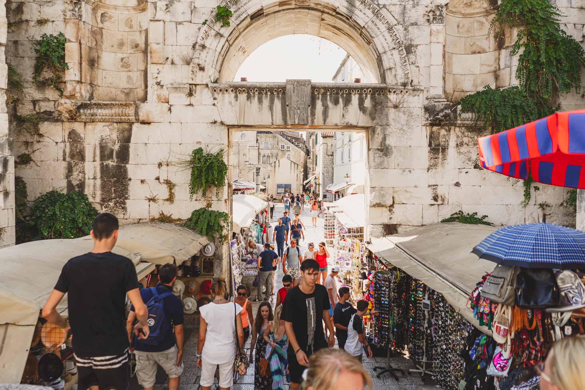 Tourists walking through the markets in the ruins of split Croatia