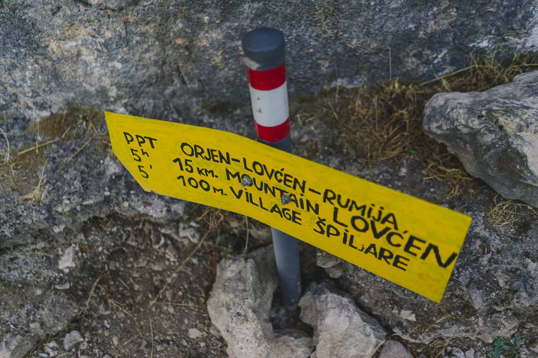 A mile marker sign on the way up the ladder of Kotor in Montenegro