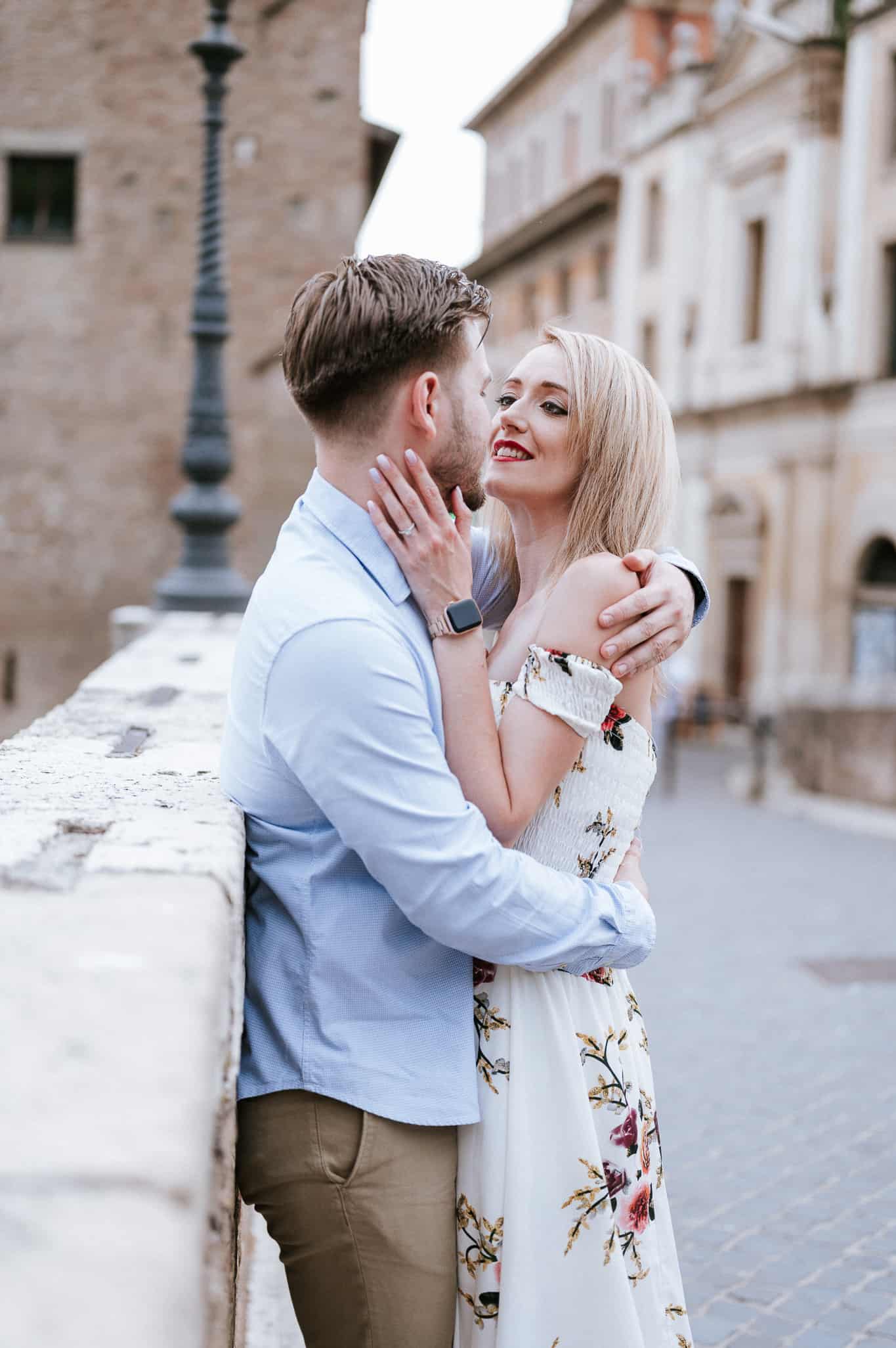 Couple sharing a romantic moment on the Tiber island in Rome Italy